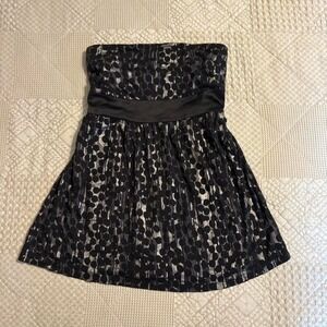 Y2K Express Black strapless top with silver polka dots and belt detail